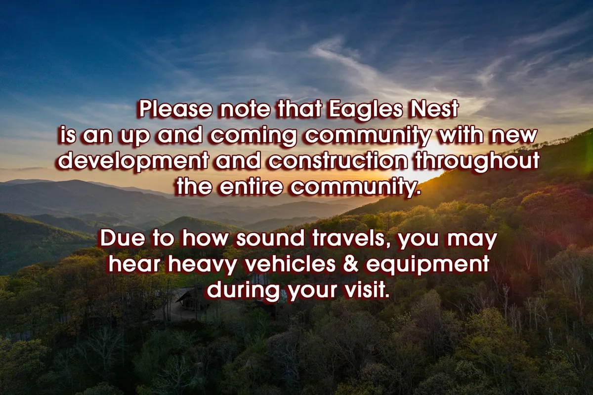 This image captures a stunning mountain landscape with a sunset sky and lush greenery, evoking the expansive natural beauty surrounding the property. The scene inspires adventure and highlights the rewards of exploring Eagles Nest’s trails with your pet.